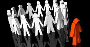 A circle of white human figures holding hands while a single red figure stands apart on the outside