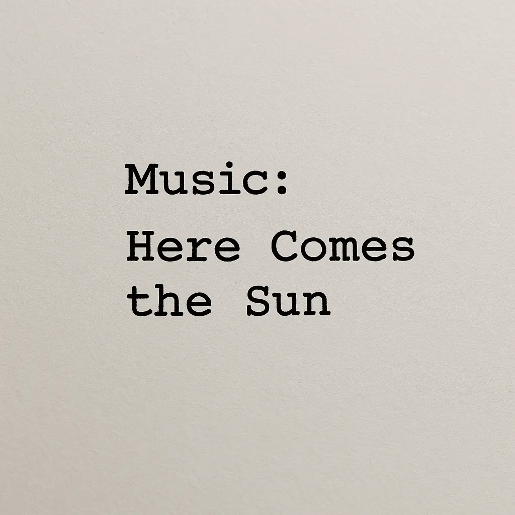 Typewriter text on plain paper reading 'Music: Here Comes the Sun'