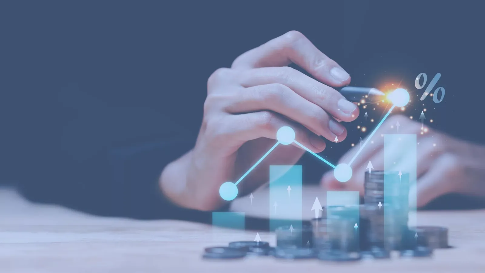 A hand touches a glowing rising line chart drawn over bar graphs and stacks of coins, with a percent sign at the peak
